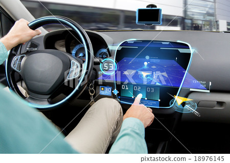 Stock Photo: close up of man driving car with navigation system