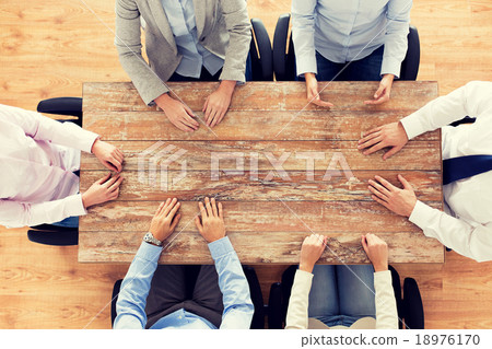 close up of business team sitting at table 18976170