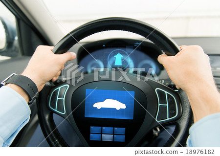 close up of man driving car with icon on computer close up of man driving car with icon on computer 18976182