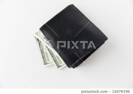 close up of dollar money in black wallet on table close up of dollar money in black wallet on table 18976596