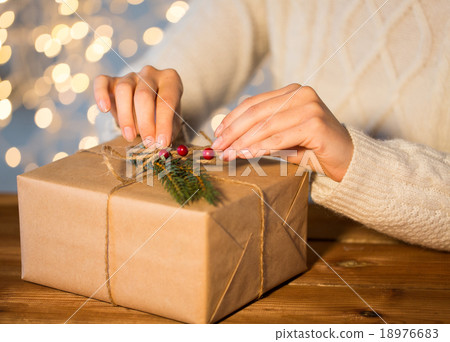 close up of woman with christmas gift or parcel close up of woman with christmas gift or parcel 18976683