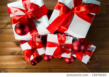 close up of gift boxes and red christmas balls 18976684