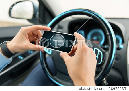 hands with navigator on smartphone in car hands with navigator on smartphone in car 18976685