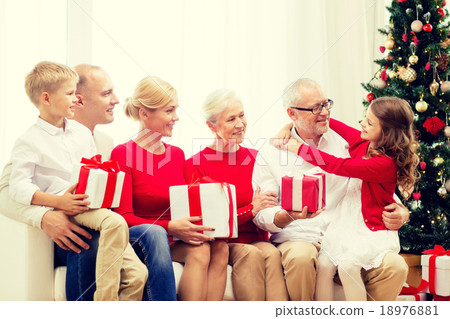 smiling family with gifts at home smiling family with gifts at home 18976881