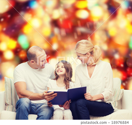 happy family with book at home 18976884