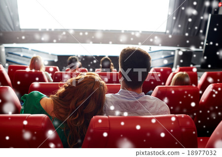 happy couple watching movie in theater or cinema happy couple watching movie in theater or cinema 18977032