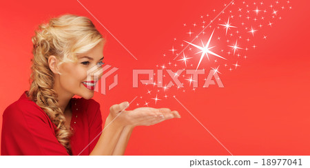 woman sending stars from palms of her hands woman sending stars from palms of her hands 18977041
