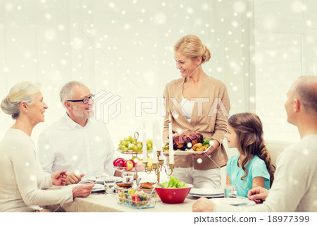smiling family having holiday dinner at home smiling family having holiday dinner at home 18977399