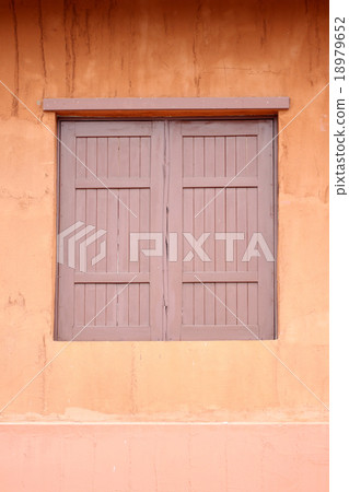 Ancient window of orange wall. Ancient window of orange wall. 18979652