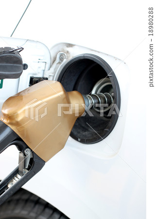 fueling a white car. fueling a white car. 18980288