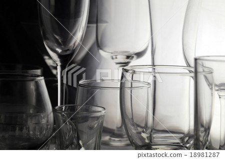 many glass placed on the foods table. 18981287