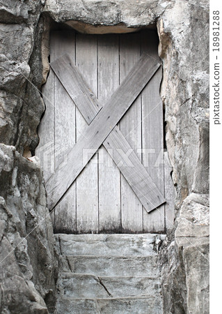 Old wooden door is closed it. 18981288
