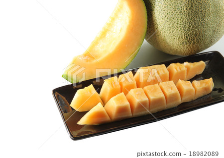 slices cantaloupe melon fruit in blackdish. 18982089