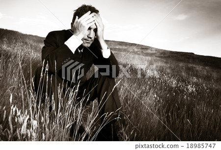 Lonely businessman depressed about life Stress Concept Lonely businessman depressed about life Stress Concept 18985747