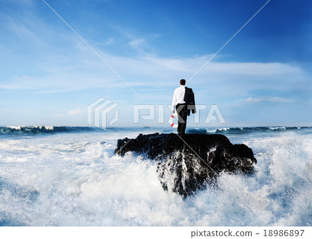 Business Man Standing Rock Ocean Life Buoy Concept Business Man Standing Rock Ocean Life Buoy Concept 18986897