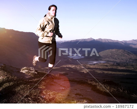 Extreme Athletes Exercising in the Mountains Concept Extreme Athletes Exercising in the Mountains Concept 18987172