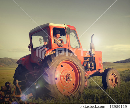 Mongolian Farmer Driving Tractor Field Agicultural Concept 18989119