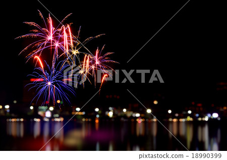 Fireworks celebration and the city night light. Fireworks celebration and the city night light. 18990399