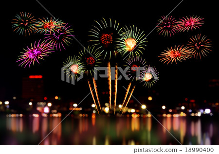 Fireworks celebration and the city night light. Fireworks celebration and the city night light. 18990400