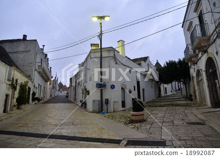 Stone pavement and sloping road of southern Italy Alberobello 18992087