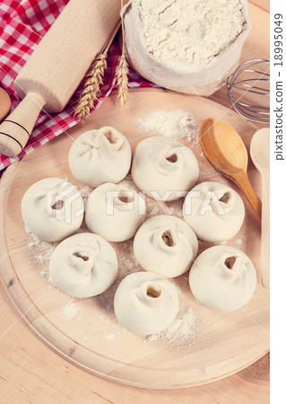 Baking ingredients for cooking manti dumplings. 18995049