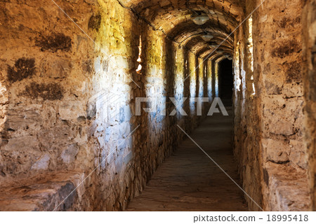Dark corridor in dungeon 18995418