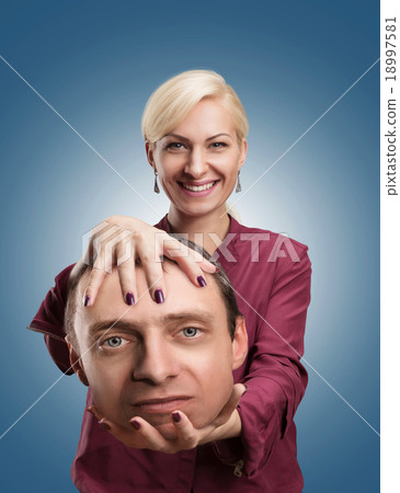 Woman with man's head in her hand Woman with man's head in her hand 18997581