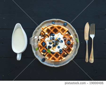 Soft Belgian waffles with blueberries, honey and Soft Belgian waffles with blueberries, honey and 19000486