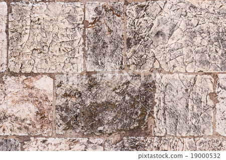 Old wall made of the Jerusalem stone Old wall made of the Jerusalem stone 19000532