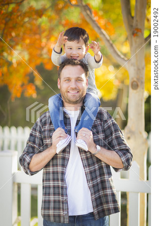 Mixed Race Boy Piggyback on Shoulders of Father 19002492