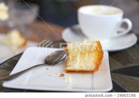 bited piece of orange yam cake 19003198