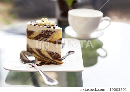 A piece of  butter and chocolate cake  19003201