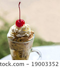 red cherry on top of ice cream  19003352