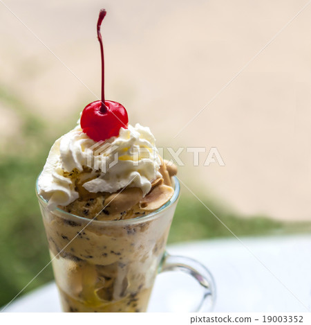red cherry on top of ice cream  19003352