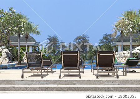 folding hammocks besides swimming poll 19003355