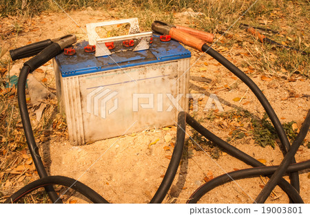 Old battery and the jumper cables 19003801
