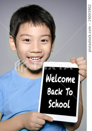 asian boy hold tablet With Back to School concept asian boy hold tablet With Back to School concept 19003902