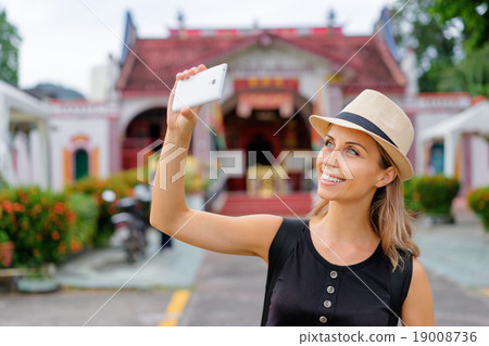 Woman taking selfie 19008736