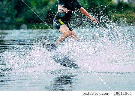 man jumps on wakeboard wave 19011805