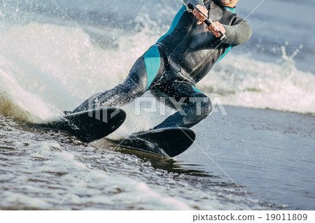 man riding on water skis 19011809