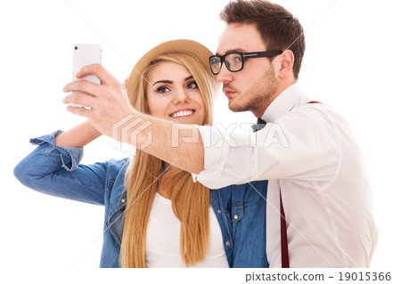 Young hipster couple making a selfie Young hipster couple making a selfie 19015366