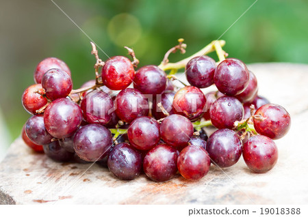 Grapes on a wooden table. Grapes on a wooden table. 19018388