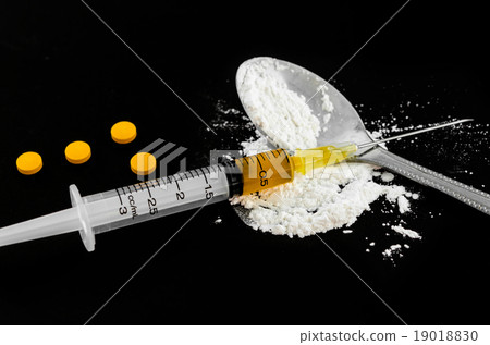 Drug syringe, amphetamine tablets. Drug syringe, amphetamine tablets. 19018830
