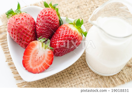 Strawberries and milk drink. 19018831
