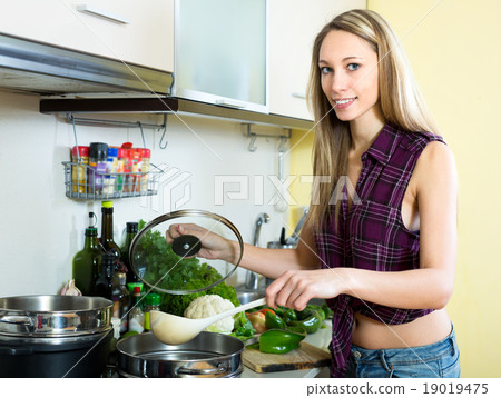 Blonde cooking in the kitchen 19019475