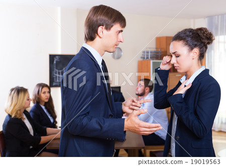 Portrait of angry boss and upset employee Portrait of angry boss and upset employee 19019563