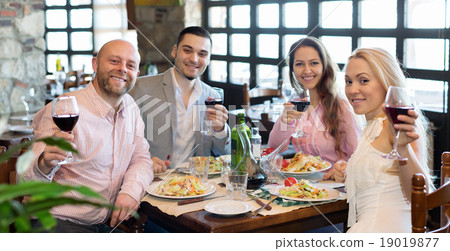 Two couple sitting at restaurant 19019877