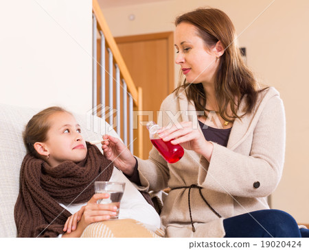 Woman caring for sick daughter 19020424