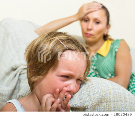 Crying child and mother having quarrel 19020489
