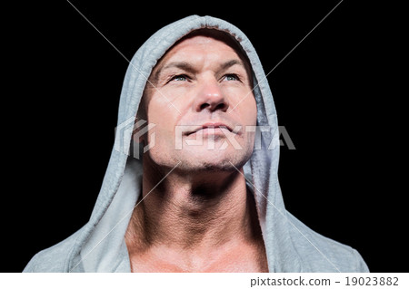 Athlete in hood looking up 19023882